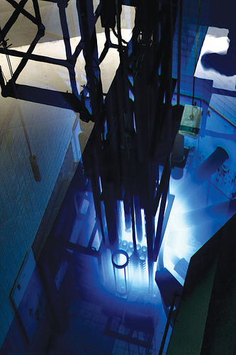 Overhead view of McMaster nuclear reactor core, which glows blue.